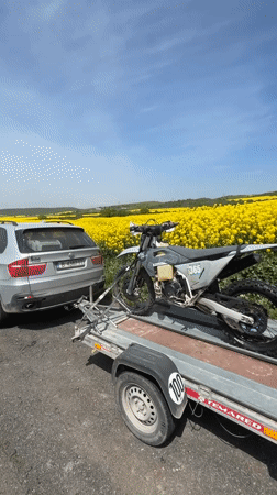 Dirt bike numbered 365 transported by trailer in Bulgaria