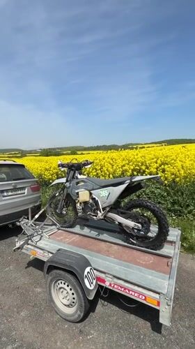 Dirt bike numbered 365 transported by trailer in Bulgaria