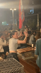 Evening dining scene captured at Tel Aviv restaurant patio