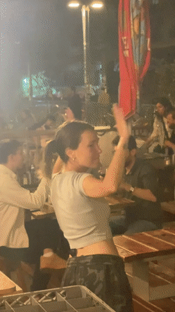 Evening dining scene captured at Tel Aviv restaurant patio