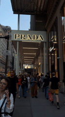 Midtown Manhattan luxury district, street-level on a September evening