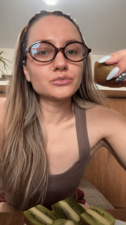 Woman applies lipstick in beauty routine, Esenyurt Turkey