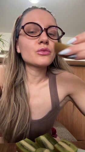Woman applies lipstick in beauty routine, Esenyurt Turkey