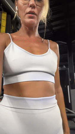Woman exercises and stretches at gym in Mengwi