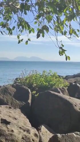 Visitor documents peaceful morning coastal scenes in Banda Aceh
