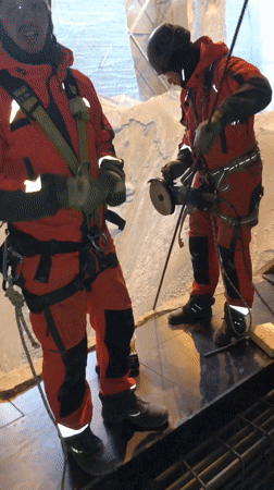 Industrial workers conduct cutting operations at Slantsy construction site