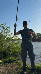 Man catches fish during afternoon fishing session in Elovo, Russia