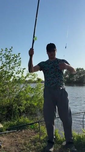 Man catches fish during afternoon fishing session in Elovo, Russia