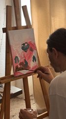 Artist paints while woman poses in Krasnoyarsk studio session