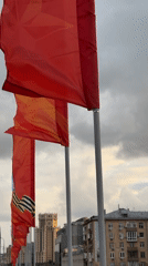 Urban scenes documented: flags, skyscraper, river cityscape, subway interior