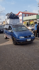 Daily life documented on Jos streets: vendors, overloaded vehicles
