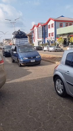 Daily life documented on Jos streets: vendors, overloaded vehicles