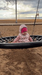 Baby plays at playground in Chaikovsky, Russia