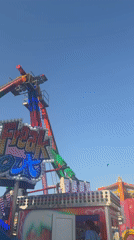 Amusement park visitors enjoy rides and water ball activities