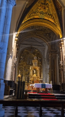 Inside a grand European cathedral's gilded interior