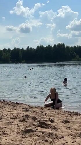 Summer lake day with swimming and paddleboarding in Novyi