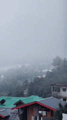 Foggy morning settles over Vashisht's hillside village and valley