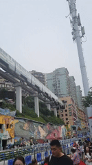 Morning street life documented around Chongqing's famous Liziba Station