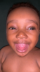 Smiling baby photographed in Barakin Akawo, Nigeria
