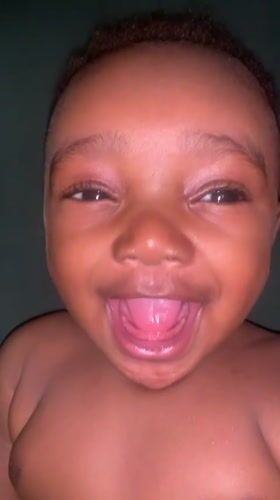 Smiling baby photographed in Barakin Akawo, Nigeria