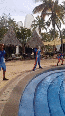 Poolside dance performance with DJ setup captured at Porlamar resort