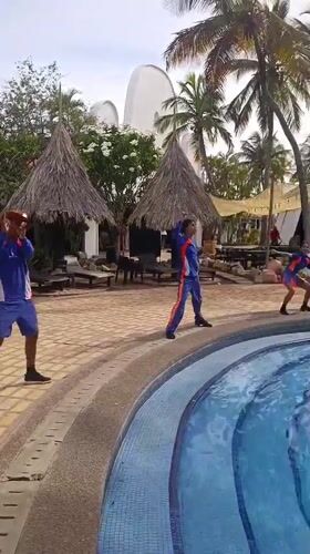 Poolside dance performance with DJ setup captured at Porlamar resort