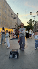 Street dancers draw a crowd on Nevsky Prospekt at midsummer dusk