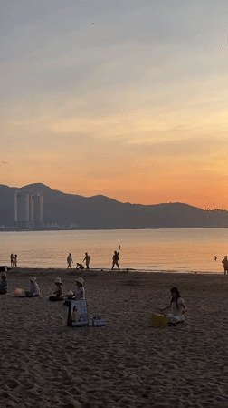 Sunset yoga and swimming witnessed at Nha Trang beach