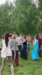 Costumed dancers gather for drum circle in Moscow park