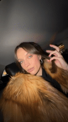 Woman in fur coat observed in car backseat, Moscow