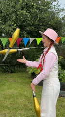Juggling practice with clubs, rings, and balls in Chaikovsky backyard