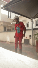 Young person inline skating in Lagos wearing red outfit