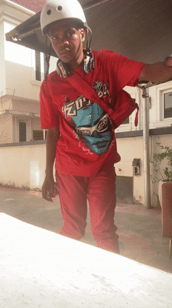 Young person inline skating in Lagos wearing red outfit