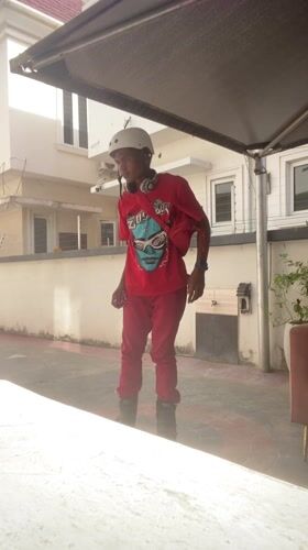 Young person inline skating in Lagos wearing red outfit