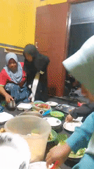 Floor meal shared among families in a Krucil home