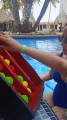 Poolside games and relaxation at Venezuelan tropical resort