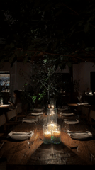 Outdoor dining table prepared with candles in Kuta Selatan