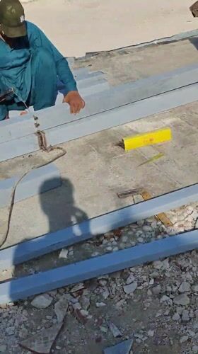 Construction workers conduct morning building activities at Jeddah coastal site