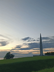 Stone monument on a grassy hill in Tallinn