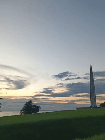 Stone monument on a grassy hill in Tallinn