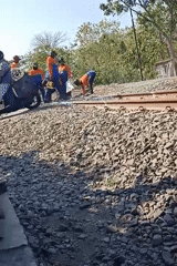 KAI rail crew does track maintenance in Banjarjo, Indonesia