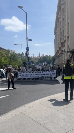 Pension reform protesters gather at Madrid street crossing