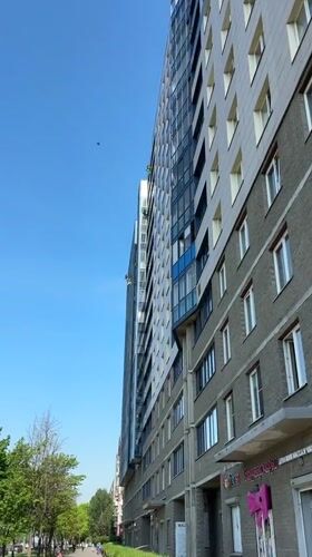 Window washers service apartment building in Vsevolozhsk, Russia