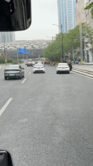 Passenger documents Shanghai street scenes during early morning commute
