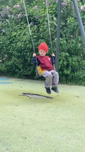 Child plays, dog rests in quiet Khimki afternoon