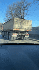 Motorist follows loaded dump truck through Sofia streets