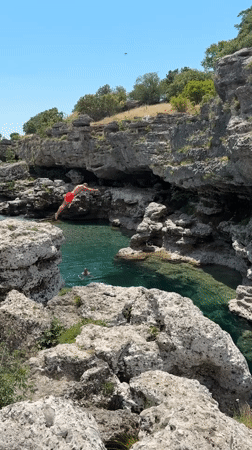 Cliff jumping at a turquoise swimming hole near Podgorica
