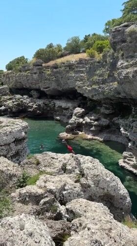 Cliff jumping at a turquoise swimming hole near Podgorica