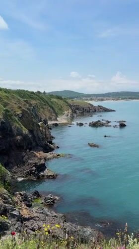 Tourist documents scenic Black Sea coastline views in Sozopol