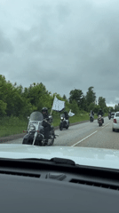 Motorcycle procession observed on Russian road near Гаревая